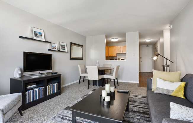 a living room with a couch a coffee table and a tv