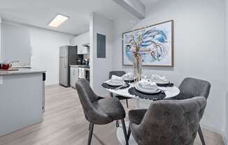 Dining area with table and chairs at The Halifax apartments in Phoenix, AZ.