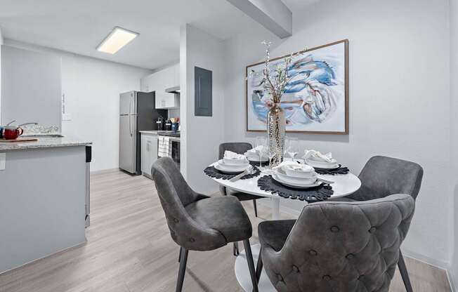 Dining area with table and chairs at The Halifax apartments in Phoenix, AZ.