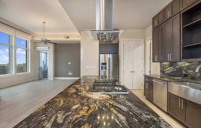 a kitchen with granite counter tops and a large island
