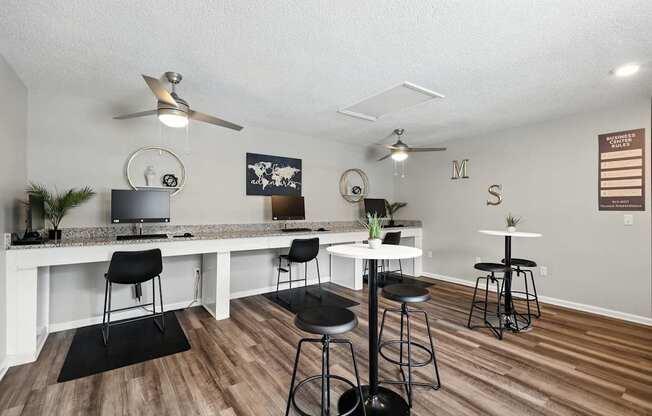 A room with a bar and stools.