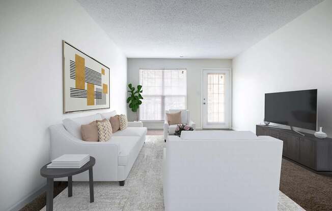 A living room with a white couch, a white coffee table, and a large painting on the wall.