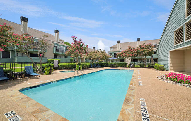 A swimming pool surrounded by a stone border with the number 37161 painted on it.