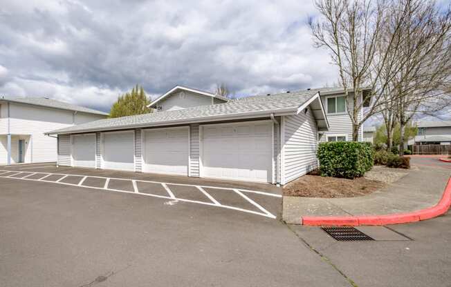 a garage with a carport in front of a house