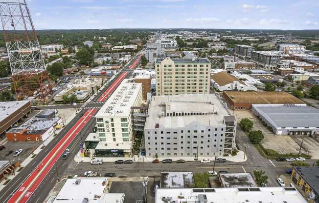 arial view of a city with a red train on the tracks  at The Icon, Virginia, 23230