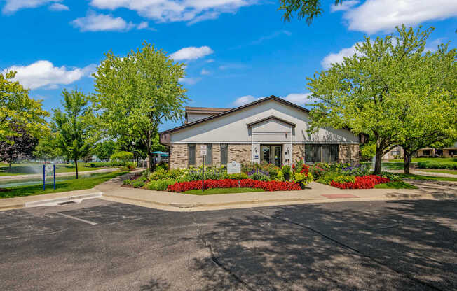 A building with a driveway in front of it.