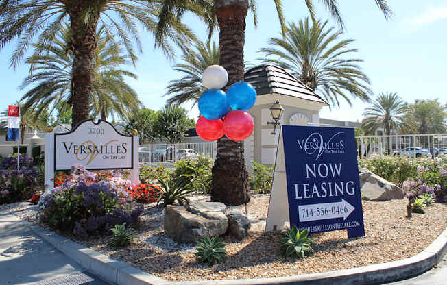 A Versailles sign is displayed in front of a leasing sign.