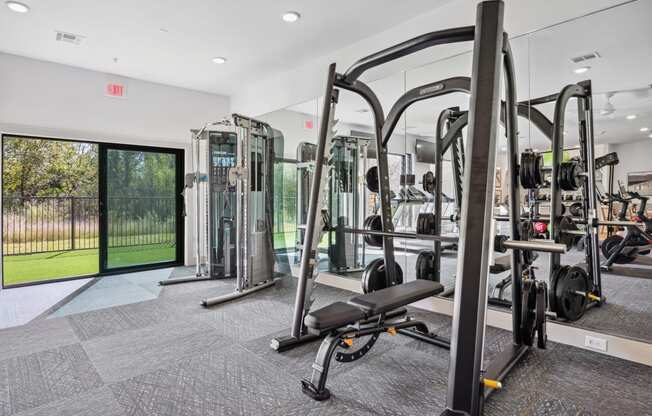 a gym with weights and cardio equipment at the preserve at greatstone