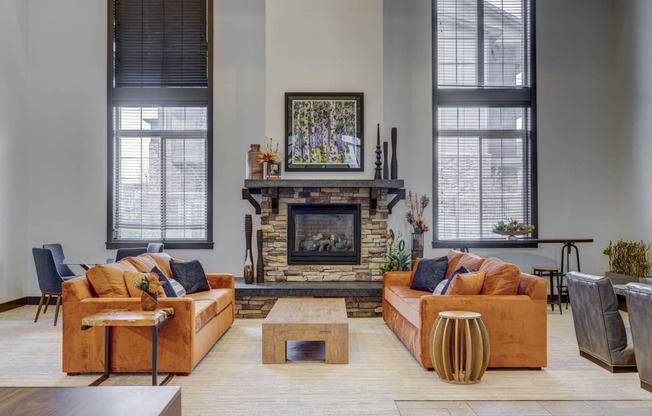 a living room with couches and a fireplace