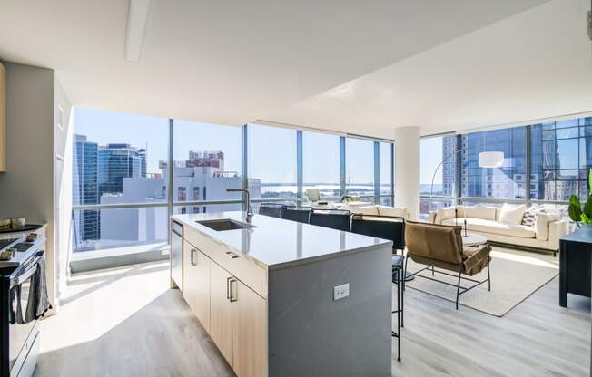 a kitchen and living room with a view of the city