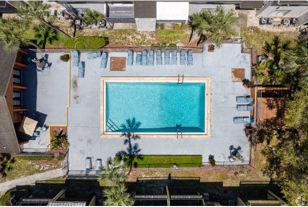 a birds eye view of the pool on the roof of a building