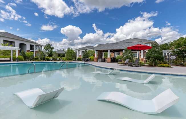 swimming pool with lounge chairs