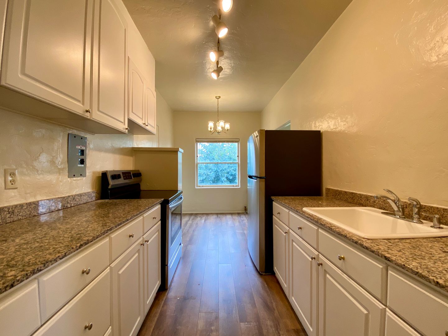 TOP FLOOR! Corner Unit w/ On-Site Laundry & Parking Available!
