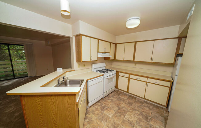 Well Equipped Kitchen at Canal Club Apartments in Lansing, MI