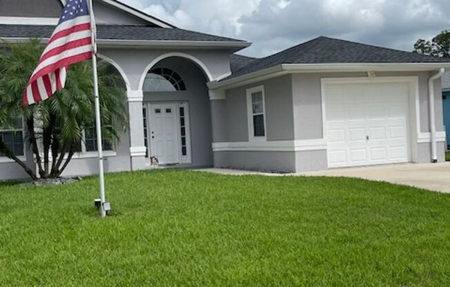 Charming 3 Bedroom 2 Bath in LeHigh Woods with Multi-purpose Room, Fully Fenced Back Yard and Solar Panels!!