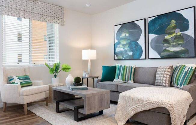 2-Bedroom Apartments in Santa Clara, CA- Santana Terrace - Furnished Living Room with Wood-Style Flooring, a Ceiling Fan, and a Window with Blinds