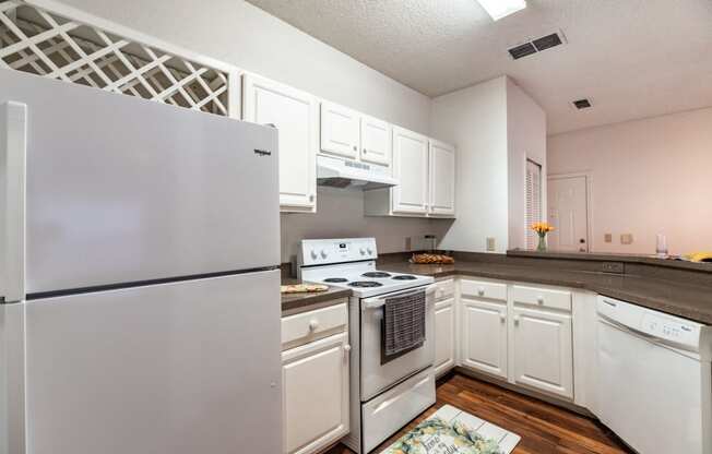 Kitchen with cabinets and appliances at Paradise Island, Florida, 32256