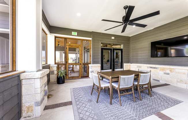 Dining area with a table and chairs and a tv at The Parker Austin, Pflugerville, 78660
