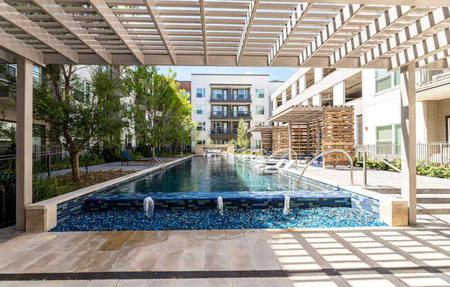 A long rectangular pool with a waterfall in the middle.