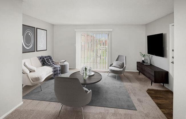Model apartment living room with a couch and a table