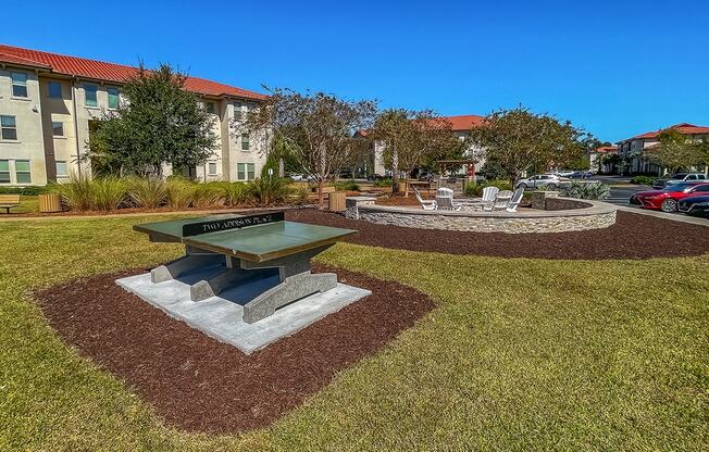 Game area with ping pong and firepit  at Two Addison Place Apartments , Georgia, 31322