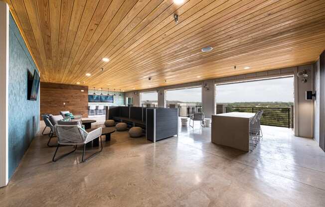 Lenox SoCo Apartments clubhouse lounge area with seating