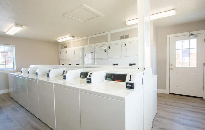 Bright Laundry Room at Waterstone Place Apartments, Indiana