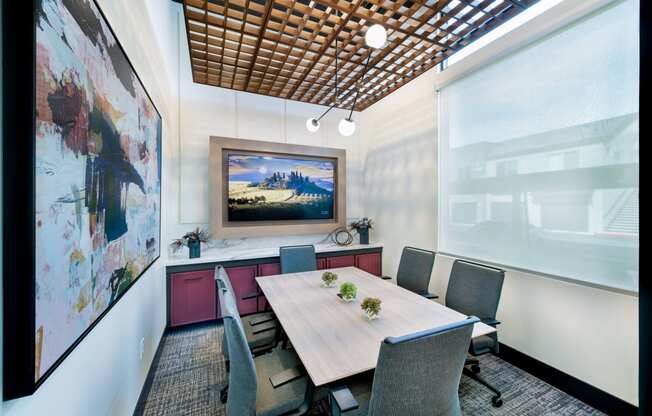 a conference room with a table and chairs