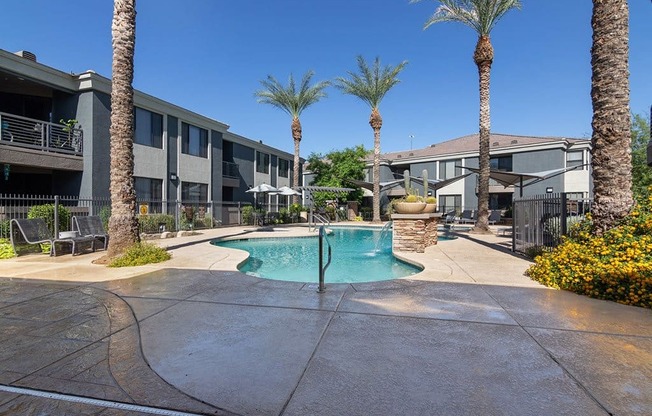 a swimming pool with palm trees in front of a building at Element Deer Valley, Phoenix, AZ, 85027