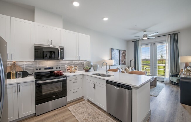 Step into modern living at Sage at Celina Residences. This stylish kitchen features sleek appliances, ample counter space, and natural light, perfect for culinary enthusiasts. Don’t miss out on your ideal home—schedule a tour today!