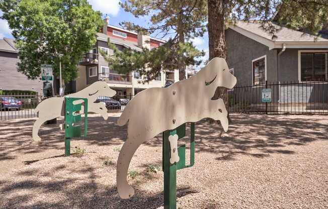 a statue of two dogs in a park