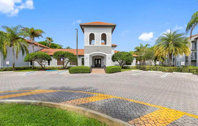 A building with a tower and a gate in front of it.
