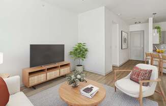 A living room with a television, a chair, a table, and a potted plant.