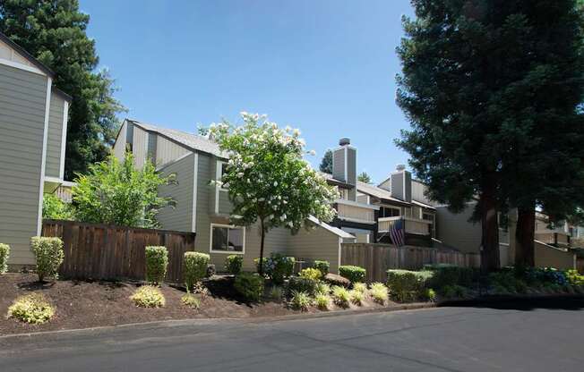 A row of houses with a clear blue sky above them.