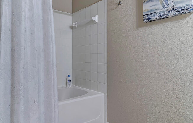 Guest bathroom with tile flooring at Bermuda Estates Apartments in Ormond Beach, FL
