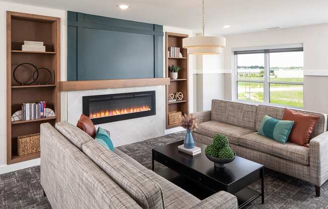 the preserve at gateway living room with couches and a fireplace