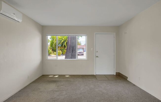Charming 2 Bed 1 Bath Duplex Unit with Beautifully Landscaped Backyard
