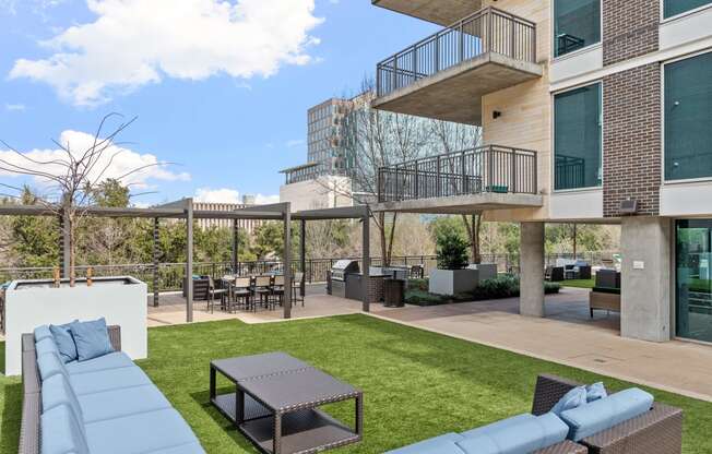 a living area with a couch and a table and a balcony