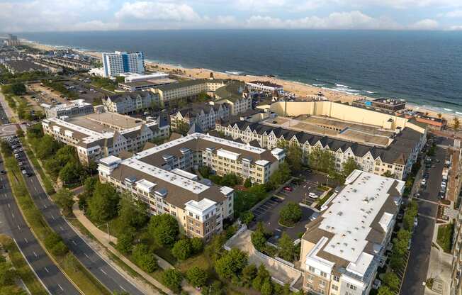 an aerial view of a city with the ocean in the background at Pier Village Apartments, Long Branch, NJ