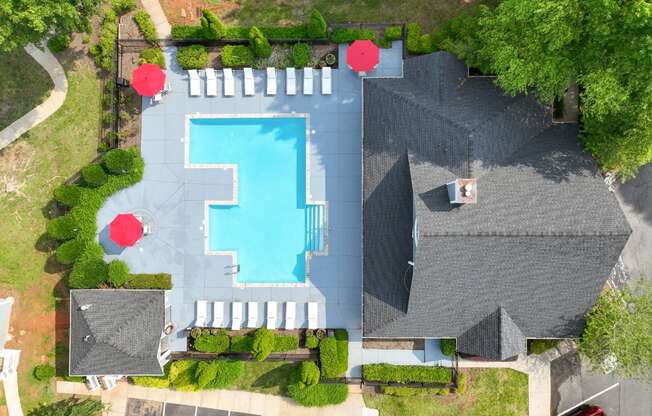 an overhead view of a house with a swimming pool
