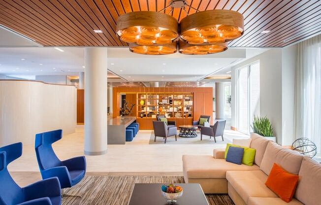 a lobby of a hotel with couches and chairs