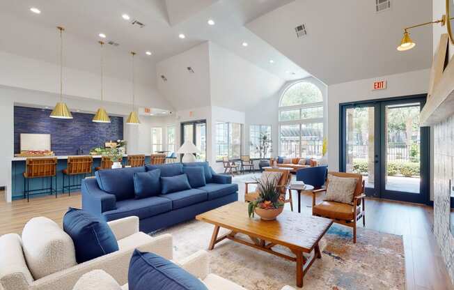 a living room with couches chairs and a coffee table