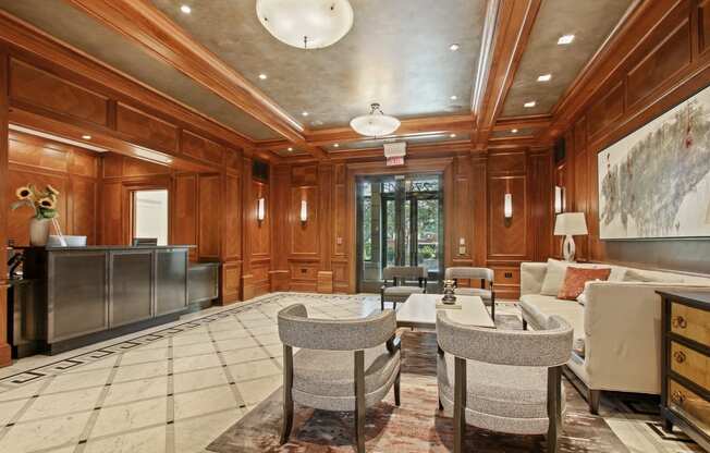 the living room has wood paneling and a marble floor