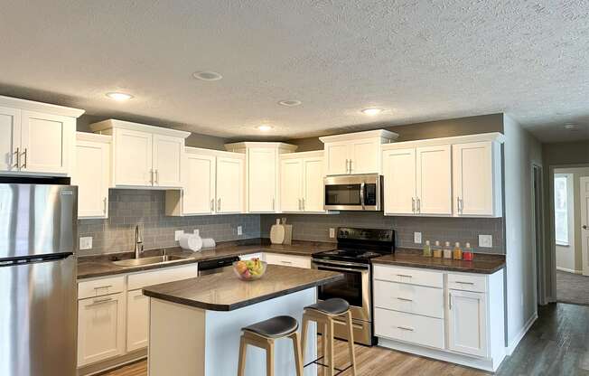Open concept kitchen at Pine Lane Estates Apartments in Lansing, MI