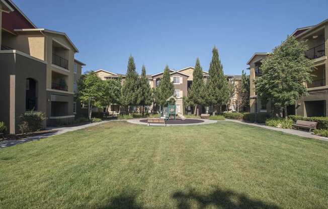 Tot Lot And Playing Field at Sterling Village Apartment Homes, California, 94590