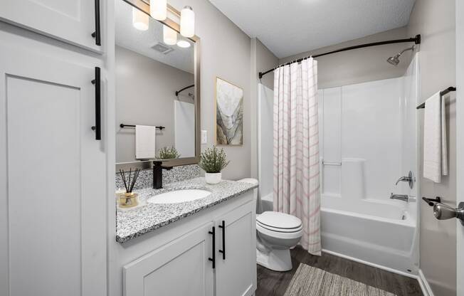 addison point interior staged model an open bathroom with a shower toilet and sink