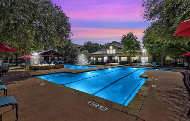 Pool View In Night at The Canyons Apartments, Fort Worth