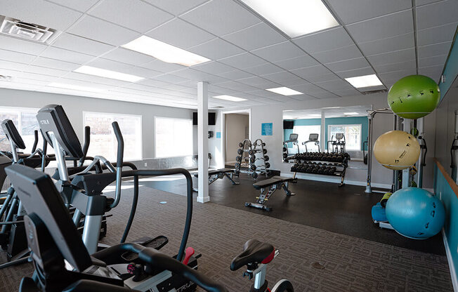 a gym with weights and other exercise equipment in a workspace