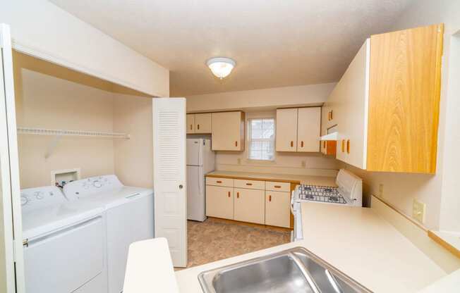 a kitchen with a washer and dryer at Brentwood Park Apartments, La Vista, 68128