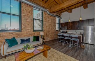 Exposed brick walls and ceiling beamsat Carriage House Lofts, Chicago, Illinois